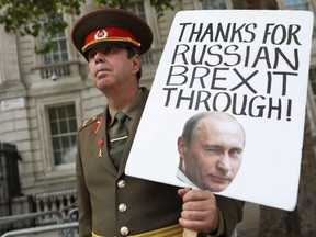 Anti-Brexit activist Steve Bray poses with a sign in London, Sept. 1, 2020.