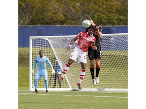 Cavalry FC's Bruno Zebie jumps for the header during Tuesday's game.