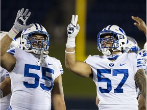 Sep 7, 2020; Annapolis, Maryland, USA; Brigham Young Cougars defensive lineman Lorenzo Fauatea (55) celebrates with defensive lineman Alden Tofa (57) after a play against the Navy Midshipmen during the second half at Navy-Marine Corps Memorial Stadium. Mandatory Credit: Scott Taetsch-USA TODAY Sports ORG XMIT: USATSI-430237