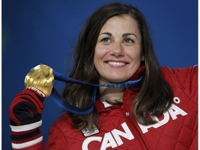 OLY--Vancouver 2010 Winter Olympics;  Canada's Maelle Ricker of holds her gold medal for snowboard cross during medal ceremonies at BC Place in Vancouver, B.C., on Wednesday, Feb. 17, 2010. Photo by ANDRE FORGET/QMI AGENCY