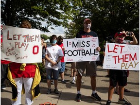 FILE PHOTO: Fans attend a protest, staged by parents of Ohio State football players, against the cancelation of the Big Ten Conference's football season due to coronavirus disease (COVID-19) concerns outside Ohio State's stadium in Columbus, Ohio, U.S., August 29, 2020. REUTERS/Megan Jelinger/File Photo ORG XMIT: FW1
