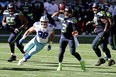 Russell Wilson of the Seattle Seahawks looks to pass against the Dallas Cowboys during the second quarter in the game at CenturyLink Field on September 27, 2020 in Seattle, Washington.