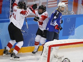 Canada forward Haley Irwin, left, celebrates her goal against the United States with teammate Blayre Turnbull during their game at the 2018 Olympic Winter Games in Pyeongchang, South Korea, on Feb. 21, 2018.