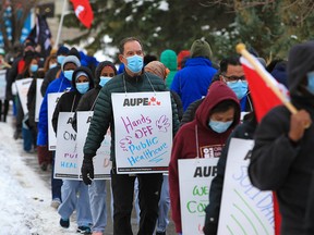Healthcare workers protest during a walkout at the Foothills Hospital in Calgary on Monday, October 26, 2020.