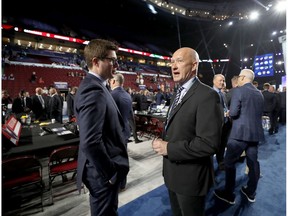 VANCOUVER, BRITISH COLUMBIA - JUNE 22: (L-R) Kyle Dubas of the Toronto Maple Leafs  and Jarmo Kekalainen of the Columbus Blue Jackets attend the 2019 NHL Draft at Rogers Arena on June 22, 2019 in Vancouver, Canada.