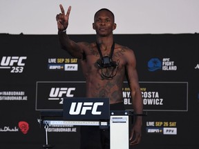 Israel Adesanya poses on the scale during the UFC 253 weigh-in on September 25, 2020 at Flash Forum on UFC Fight Island, Abu Dhabi, United Arab Emirates.