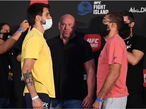 Opponents Carlos Condit and Court McGee face off during the UFC Fight Night weigh-in on October 02, 2020 in Abu Dhabi, United Arab Emirates.