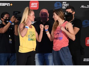 ABU DHABI, UNITED ARAB EMIRATES - OCTOBER 02:  In this handout image provided by UFC, (L-R) Opponents Holly Holm and Irene Aldana of Mexico face off  during the UFC Fight Night weigh-in on October 02, 2020 in Abu Dhabi, United Arab Emirates.