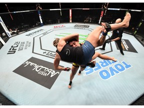 Jessica Andrade of Brazil takes down Katlyn Chookagian in their women’s flyweight bout during UFC Fight Night event inside Flash Forum on UFC Fight Island on October 18, 2020 in Abu Dhabi, United Arab Emirates.