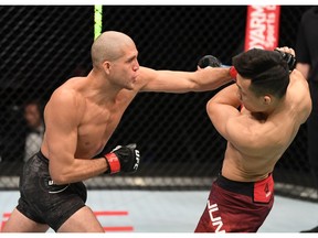 ABU DHABI, UNITED ARAB EMIRATES - OCTOBER 18: In this handout image provided by UFC, (L-R) Brian Ortega punches The Korean Zombie Chan Sung Jung in their featherweight bout during the UFC Fight Night event inside Flash Forum on UFC Fight Island on October 18, 2020 in Abu Dhabi, United Arab Emirates.