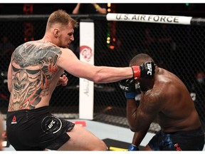Alexander Volkov punches Walt Harris in their heavyweight bout during UFC 254 on October 24, 2020 on UFC Fight Island, Abu Dhabi, United Arab Emirates.