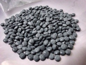 Fentanyl pills are shown in an undated police handout photo. A man who pleaded guilty to selling a mix of drugs containing fentanyl to a man who later overdosed and died apologized in court Monday.