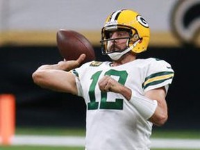 Aaron Rodgers of the Green Bay Packers attempts a pass against the New Orleans Saints during the first half at Mercedes-Benz Superdome on September 27, 2020 in New Orleans, Louisiana.
