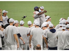 SAN DIEGO, CALIFORNIA - OCTOBER 17: Randy Arozarena #56  of the Tampa Bay Rays receives the MVP while celebrating a 4-2 win against the Houston Astros to win the American League Championship Series at PETCO Park on October 17, 2020 in San Diego, California.