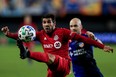 Toronto FC midfielder Alejandro Pozuelo plays the ball against FC Cincinnati.