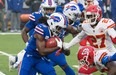 Buffalo Bills wide receiver Andre Roberts prepares to be tackled by Kansas City Chiefs' Byron Pringle (13) and cornerback Rashad Fenton on Monday night.