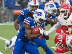 Buffalo Bills wide receiver Andre Roberts prepares to be tackled by Kansas City Chiefs' Byron Pringle (13) and cornerback Rashad Fenton on Monday night.