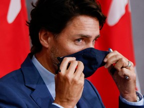 FILE PHOTO: Canada's Prime Minister Justin Trudeau prepares to leave a news conference on Parliament Hill in Ottawa, Ontario, Canada September 25, 2020. REUTERS/Blair Gable/File Photo ORG XMIT: FW1