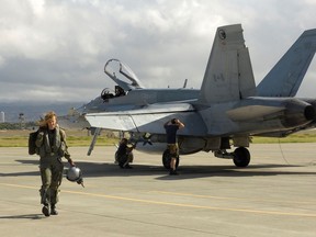 Lt.-Col Riel Erickson is seen here walking away from a CF-18, which she used to pilot. Erickson has taken over as commander of the 2 Canadian Forces Flying Training School in Moose Jaw, Sask.