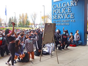 Bishop McNally High School students protest outside Calgary Police Headquarters after they staged a walkout over recent racial incidents on Thursday, October 8, 2020. The students walked from their school to the nearby headquarters building.