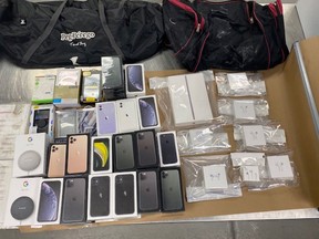 RCMP in Calgary executed a search warrant at a southeast city home and located $70,000 worth of cell phones and electronics after a robbery at a Rogers Communication store in Okotoks.