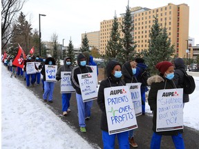 Healthcare workers protest during a walkout at the Foothills Hospital in Calgary on Monday, October 26, 2020.