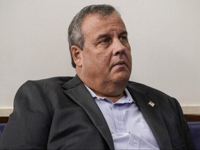 Former New Jersey Governor Chris Christie listens as U.S. President Donald Trump speaks during a news conference in the Briefing Room of the White House in Washington, D.C., Sept. 27, 2020.