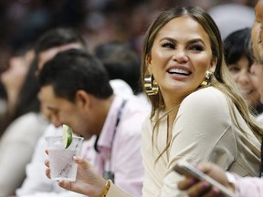 Chrissy Teigen looks on during the second half between the Miami Heat and the Philadelphia 76ers at American Airlines Arena on April 9, 2019 in Miami, Florida.