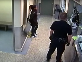 A still from a video in which Const. Alexander Dunn is shown throwing Dalia Kafi to the floor. The still is captured from before the incident.