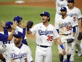 Los Angeles Dodgers centre fielder Cody Bellinger celebrates with teammates after defeating the Tampa Bay Rays in Game 1 of the 2020 World Series at Globe Life Field in Arlington, Texas, on Oct. 20, 2020.