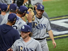 Tampa Bay Rays second baseman Brandon Lowe celebrates with teammates after defeating the Los Angeles Dodgers in Game 2 of the 2020 World Series at Globe Life Field on Oct. 21, 2020.