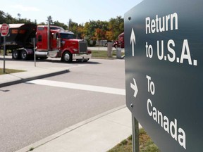 A truck leaves the Canada-United States border crossing at the Thousand Islands Bridge, which remains closed to non-essential traffic to combat the spread of the COVID-19 in Lansdowne, Ont., Sept. 28, 2020.