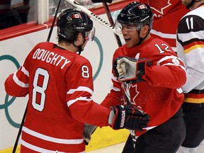 Canada's Jerome Iginla (right) celebrates his second period goal with team-mate Drew Doughty in men's hockey game against Germany in Vancouver BC  Tuesday, February 23, 2010 during the Winter Olympics.