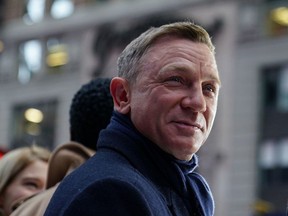 Actor Daniel Craig reacts during a promotional appearance on TV in Times Square for the new James Bond movie "No Time to Die" in the Manhattan borough of New York City, New York, U.S., December 4, 2019.