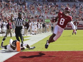 Alabama wide receiver John Metchie floats into the end zone with a touchdown against Texas A&M at Bryant-Denny Stadium in Tuscaloosa, Ala., on Oct. 3, 2020.