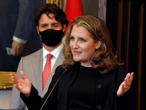 Finance Minister Chrystia Freeland speaks to reporters next to Prime Minister Justin Trudeau on Parliament Hill in Ottawa Aug. 18, 2020.