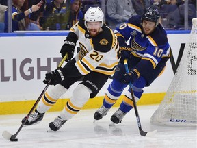 The Boston Bruins’ Joakim Nordstrom controls the puck against the St. Louis Blues’ Brayden Schenn During Game 3 of the Stanley Cup Final at the Enterprise Center in St Louis on June 1, 2019.