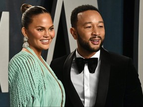 Chrissy Teigen and John Legend attend the 2020 Vanity Fair Oscar Party hosted by Radhika Jones at Wallis Annenberg Center for the Performing Arts on Feb. 9, 2020 in Beverly Hills.