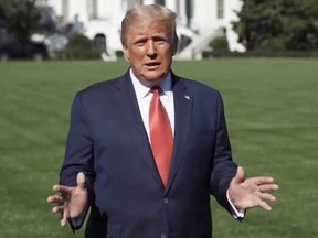 U.S. President Donald Trump speaks outside the White House, where he is being treated for COVID-19, in Washington, D.C., in this still image taken from social media video released on Oct. 8, 2020.