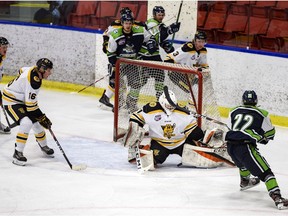 Calgary Canucks Ben Kotylak attempts to score against Old Grizzlys goalie Tristan Martin during the Alberta Junior Hockey League in Max Bell Arena on Wednesday, October 14, 2020. The Grizzlys won 3-2.  Azin Ghaffari/Postmedia