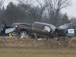 Investigators examine a scene on County Rd. 17 in Kawartha Lakes, Ont., on Friday, Nov. 27, 2020. Ontario's police watchdog agency says a child was shot dead and two others, including an officer, were injured in the incident.