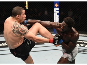 Jared Cannonier punches Robert Whittaker of Australia in their middleweight bout during the UFC 254 event on October 25, 2020 on UFC Fight Island, Abu Dhabi, United Arab Emirates.