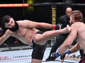Andrei Arlovski of Belarus kicks Tanner Boser in a heavyweight fight during the UFC Fight Night event at UFC APEX in Las Vegas on Nov. 7, 2020.