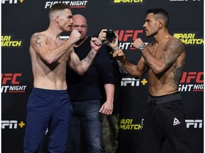 LAS VEGAS, NEVADA - NOVEMBER 13: In this UFC handout,  (L-R) Opponents Paul Felder and Rafael Dos Anjos of Brazil face off during the UFC weigh-in at UFC APEX on November 13, 2020 in Las Vegas, Nevada.