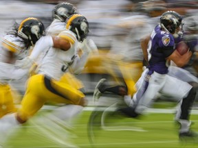 Wide receiver Willie Snead, right, of the Baltimore Ravens carries the ball against the Pittsburgh Steelers during the first half at M&T Bank Stadium on Nov. 1, 2020 in Baltimore, Md.
