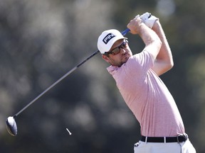 Corey Conners plays his shot from the 10th tee during the third round of the Houston Open at Memorial Park Golf Course in Houston on Nov. 7, 2020.