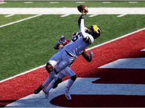 *** BESTPIX *** BLOOMINGTON, INDIANA - NOVEMBER 07: Cornelius Johnson #6 of the Michigan Wolverines catches a touchdown pass during the first quarter against the Indiana Hoosiers at Memorial Stadium on November 07, 2020 in Bloomington, Indiana.