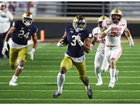 CHESTNUT HILL, MASSACHUSETTS - NOVEMBER 14: Avery Davis #3 of the Notre Dame Fighting Irish runs the ball during the second half of the game against the Boston College Eagles at Alumni Stadium on November 14, 2020 in Chestnut Hill, Massachusetts.