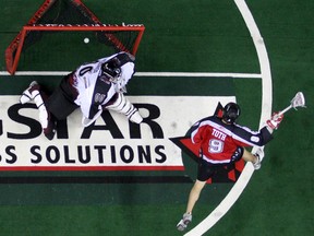 Roughnecks Kaleb Toth scores on Mammoth netminder Curtis Palidwor second half NLL Western Division Semi Finals yesterday at Saddledome as the as the Colorado Mammoth lost to Calgary Roughnecks 15-8 and eliminated from the playoffs. Saturday, May 03n/a ORG XMIT: caltoth050