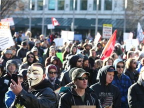 Hundreds of upporters gather during a large rally in Municipal Plaza in downtown Calgary on Saturday, November 28, 2020. About 1000 participants, from a few different groups were opposed to a number of things-the federal, provincial and civic governments, anti-masking, and end the lockdown. The group eventually marched up and down Stephen Ave Mall.